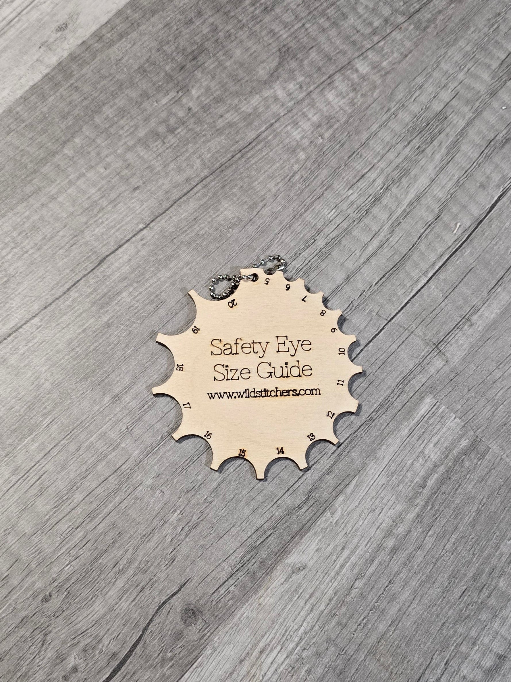 Gray wooden flooring with a visible brand logo in the center.