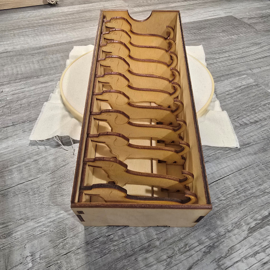 Wooden thread bobbin storage box with decorative bobbins