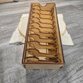 Wooden thread bobbin storage box with decorative bobbins
